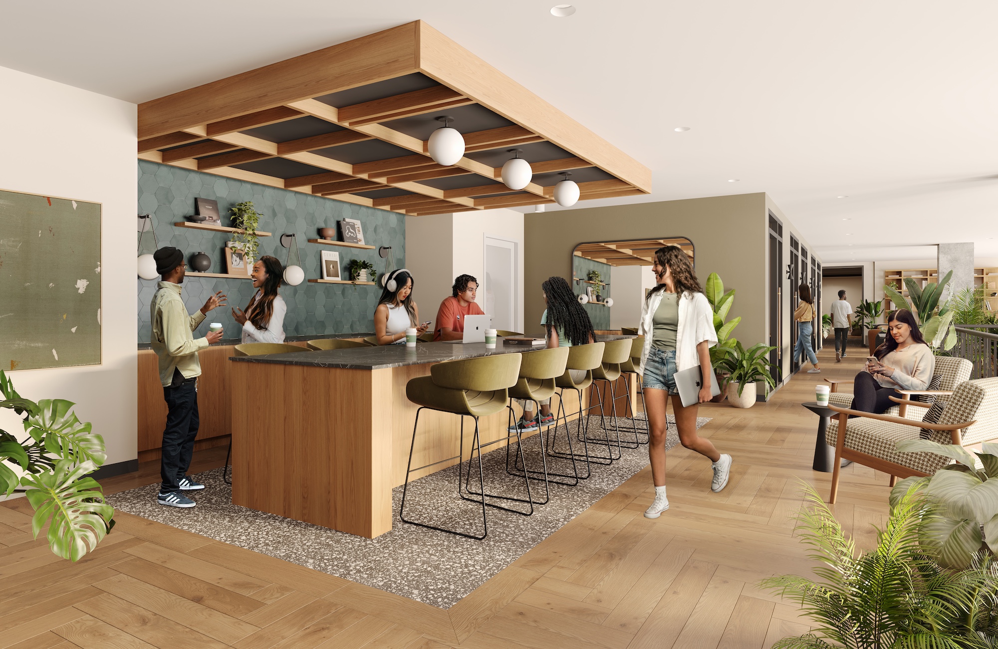 Modern, open office space with people socializing at a central island counter—reminiscent of University of Maryland housing—surrounded by plants, wooden floors and comfortable seating. Bright lighting and warm decor create a relaxed atmosphere.
