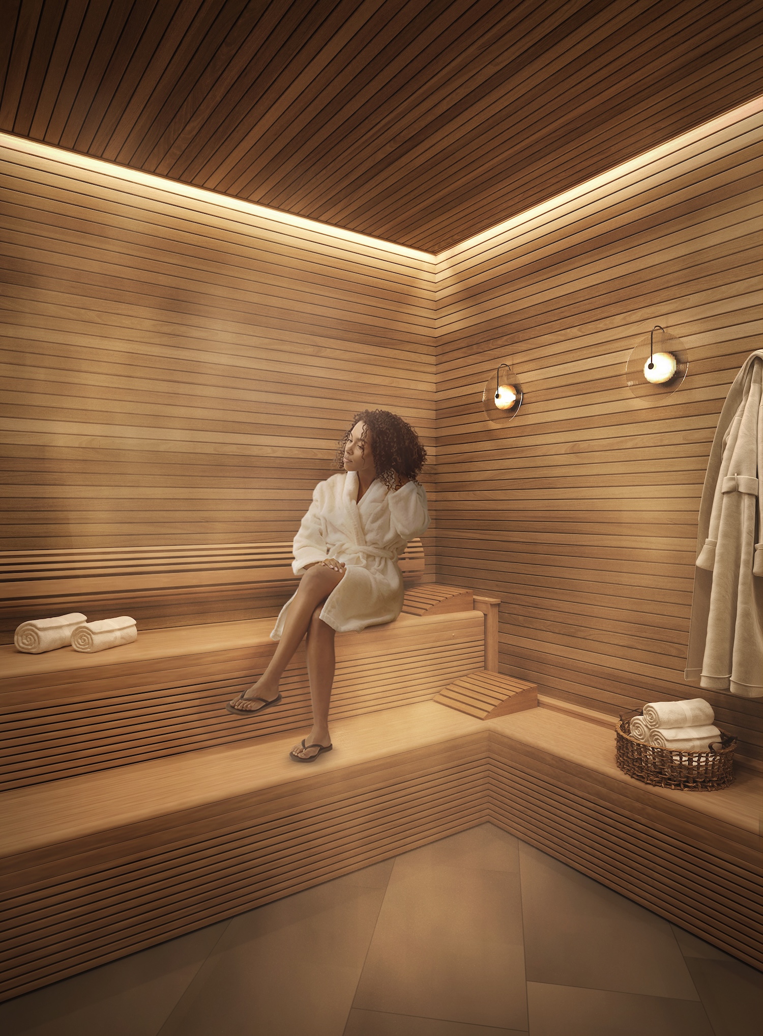 A woman in a white robe sits on a wooden bench inside a modern sauna with warm lighting. Rolled towels and a basket are nearby, and a robe hangs on the wall as steam gently fills the cozy sauna space.