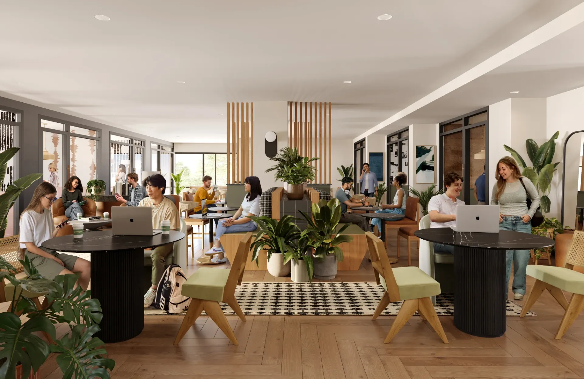 Residents studying in the coworking space at Rambler College Park North