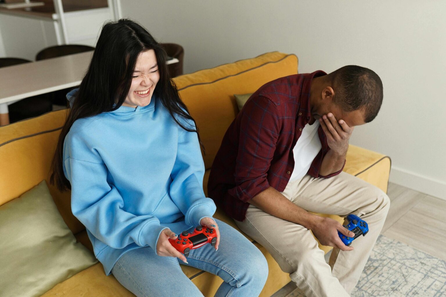 two people playing video games in the game room at landmark college park