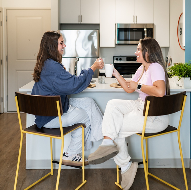 Roommates sharing a meal at Rambler College Park South