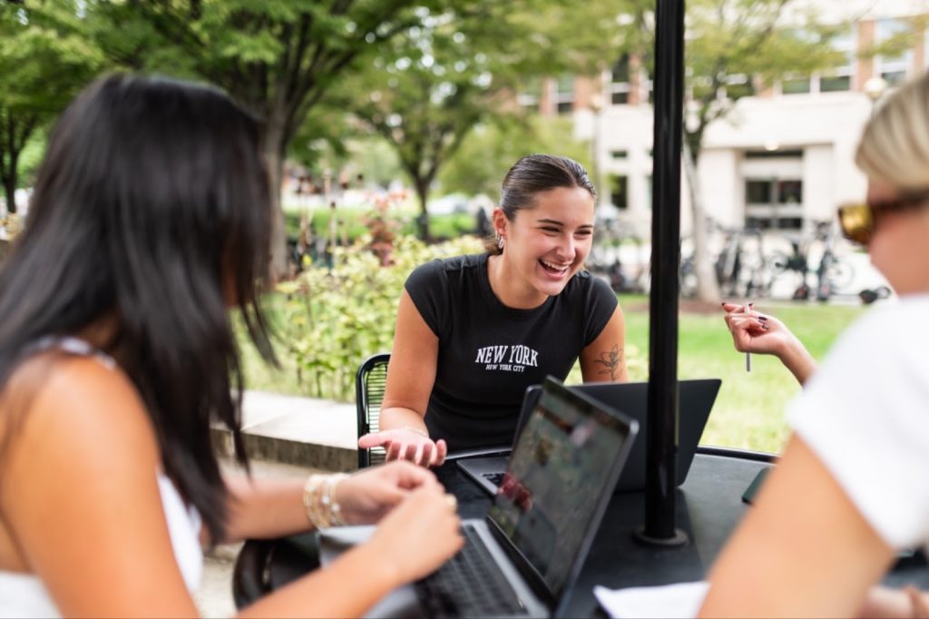 Students gathered outside studying.