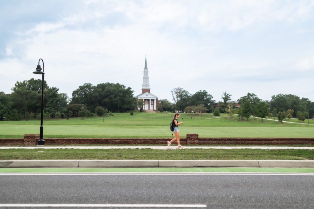 Student walking on campus at The University of Maryland.