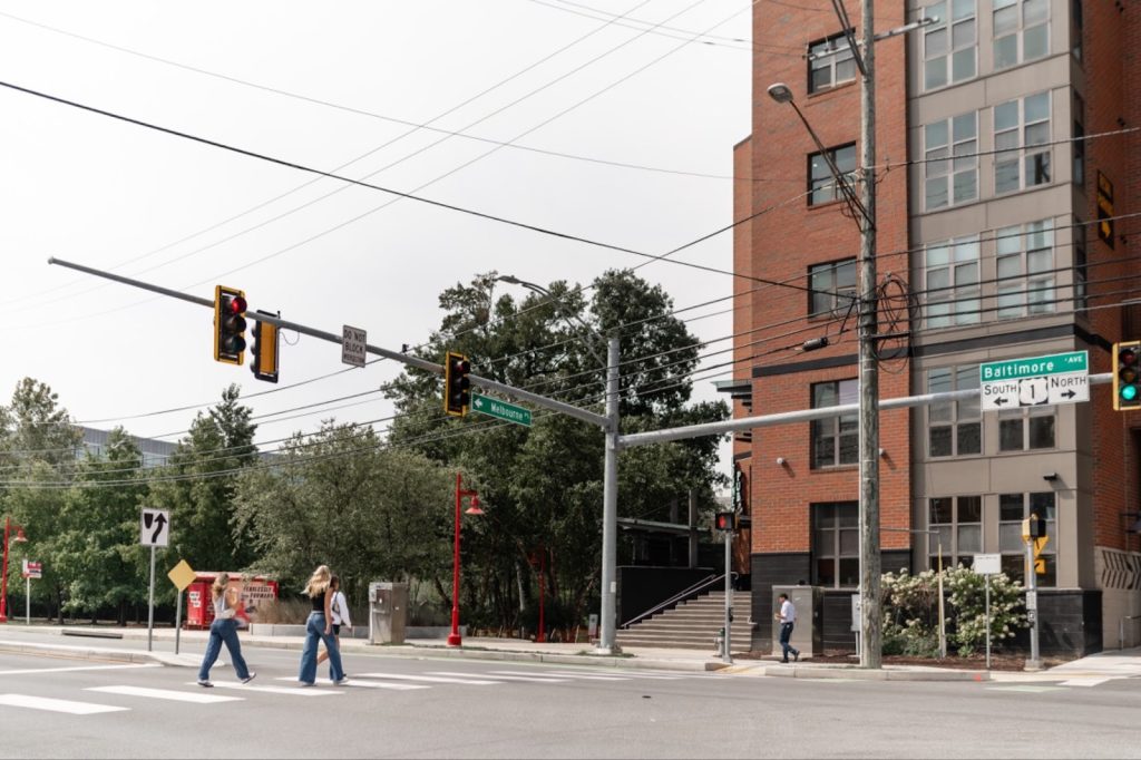 Students walking on Baltimore Avenue on North Campus. 