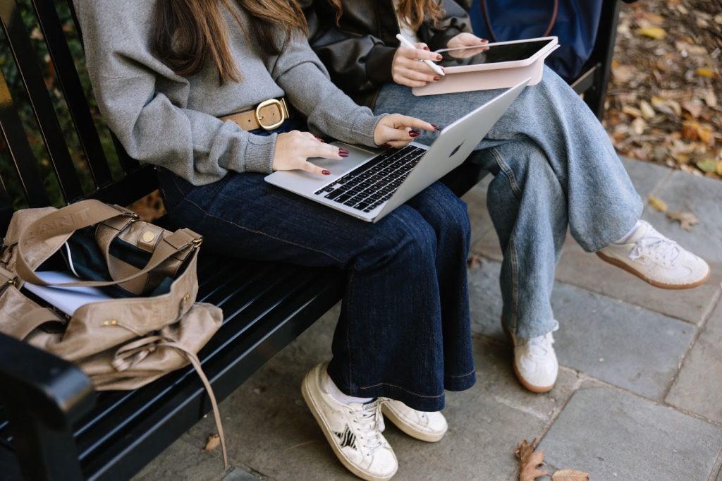 University of Maryland transfer/exchange students do research on their laptops for housing in College Park.