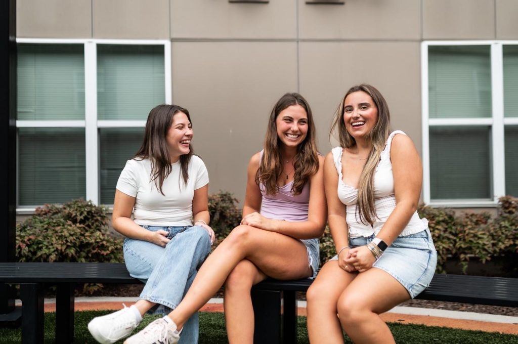 Roommates at UMD hanging out together outside. 