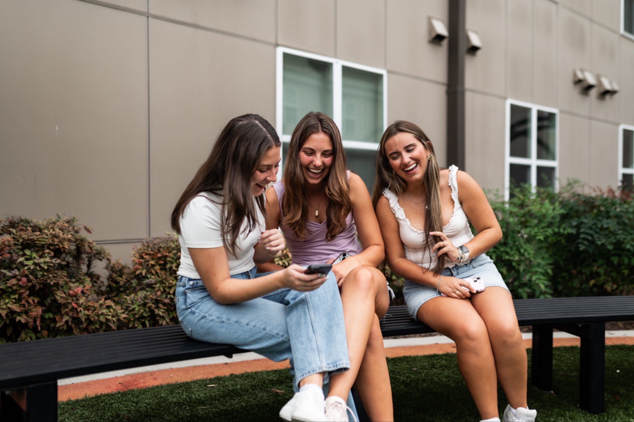 Students hanging out in an off-campus courtyard. 