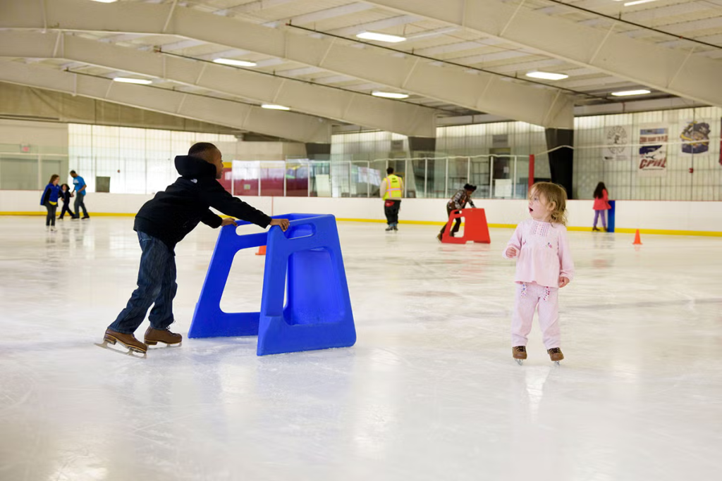 People skating at the ice rink.