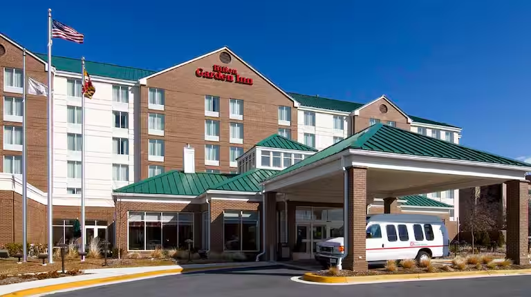 The Hilton Garden Inn from the driveway entrance to the main lobby.