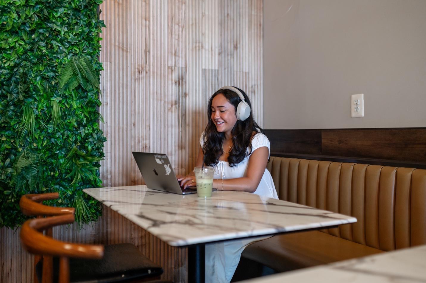 A University of Maryland student studying in Board and Brew, a popular restaurant and cafe in College Park. 