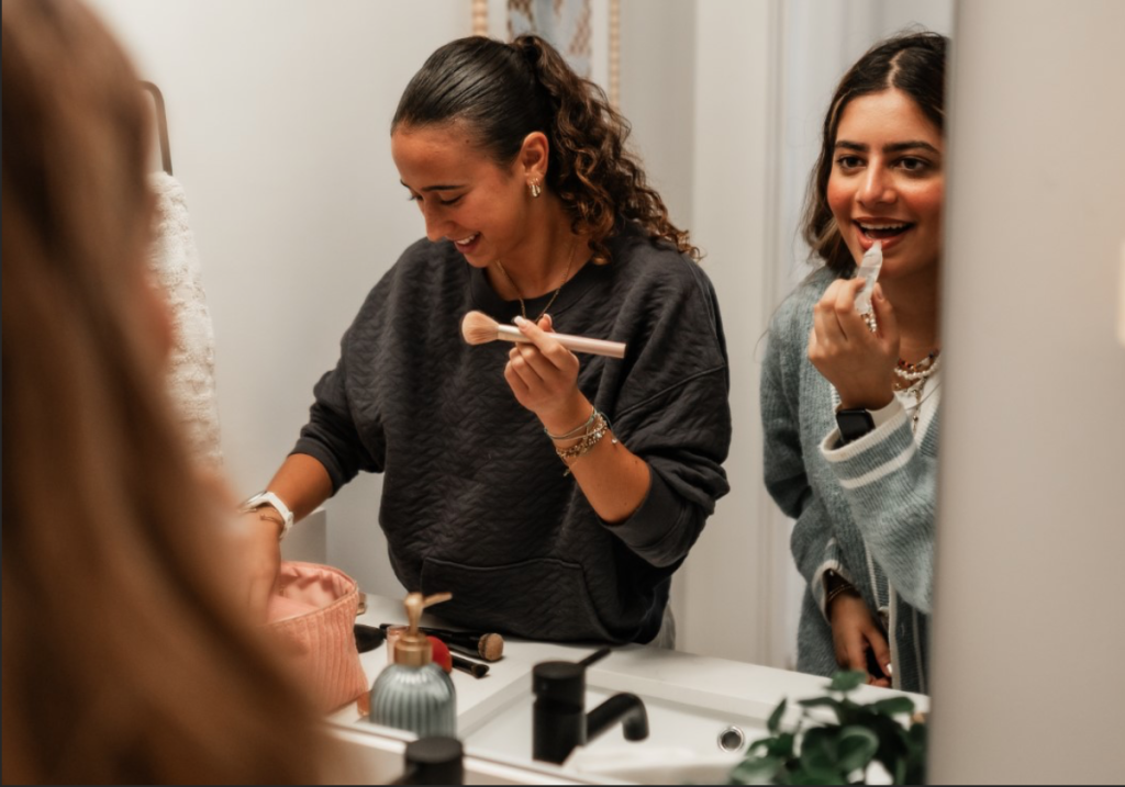Roommates freshen up in their unit’s apartment bathroom at Rambler in College Park.