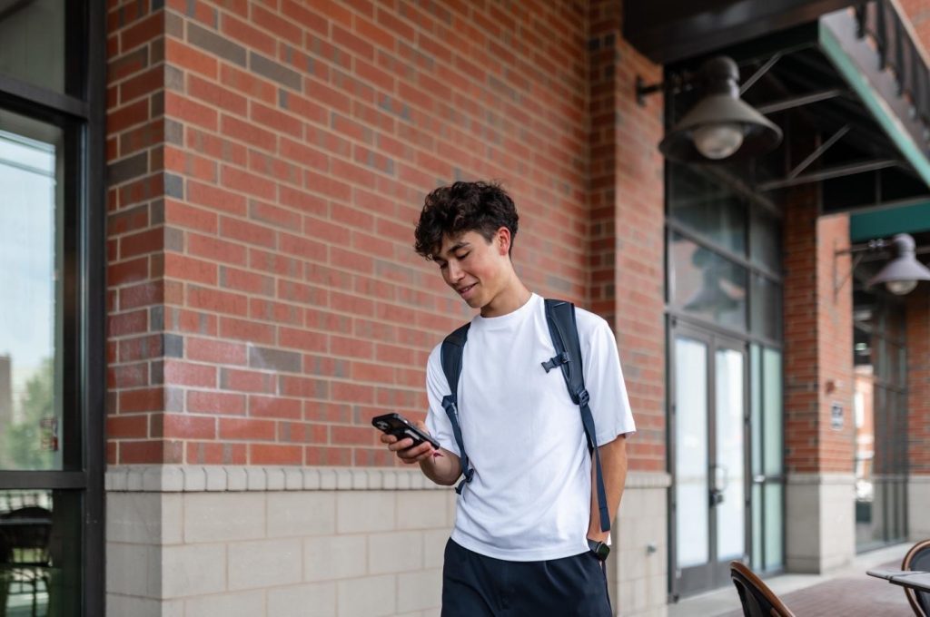 student taking a walk near UMD campus. 
