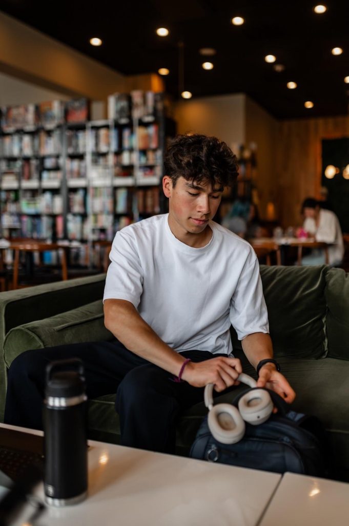 Student studying in a coffee shop on Route 1, near UMD campus.