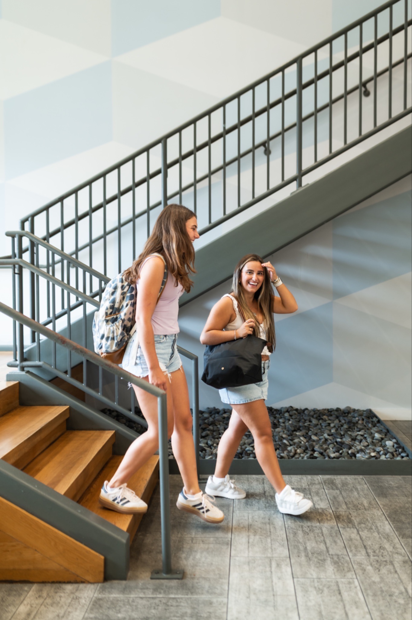 Students walking out of their off-campus apartment.