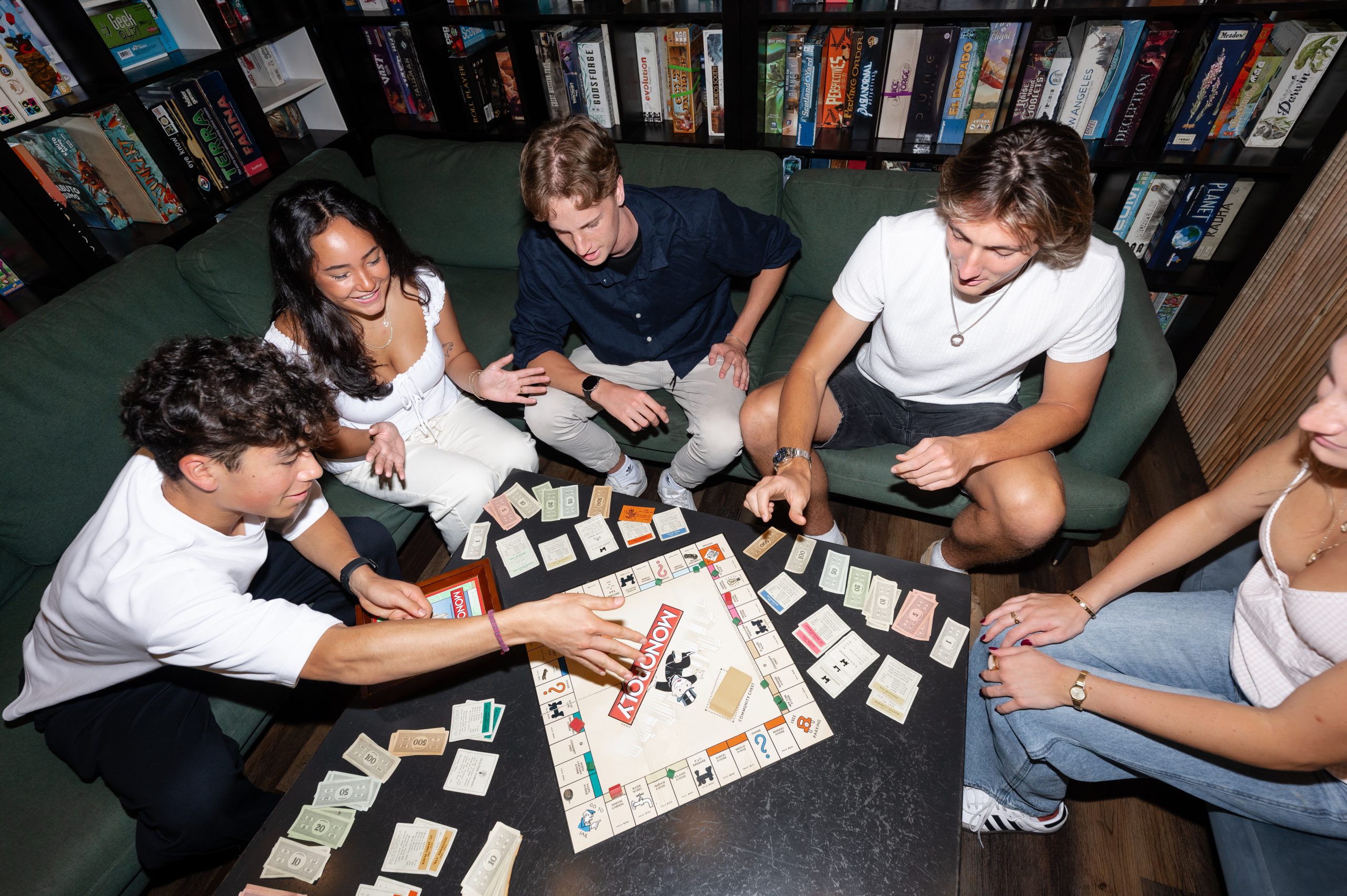 Students playing board games at The Board and Brew, a popular spot near UMD campus.