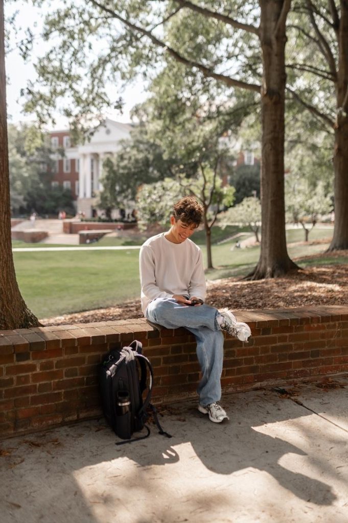 Student relaxing on McKeldin Mall on UMD’s campus.