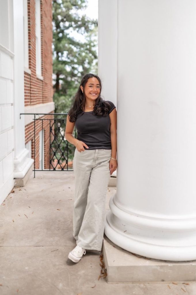 Student outside of the administrative building on UMD’s campus.