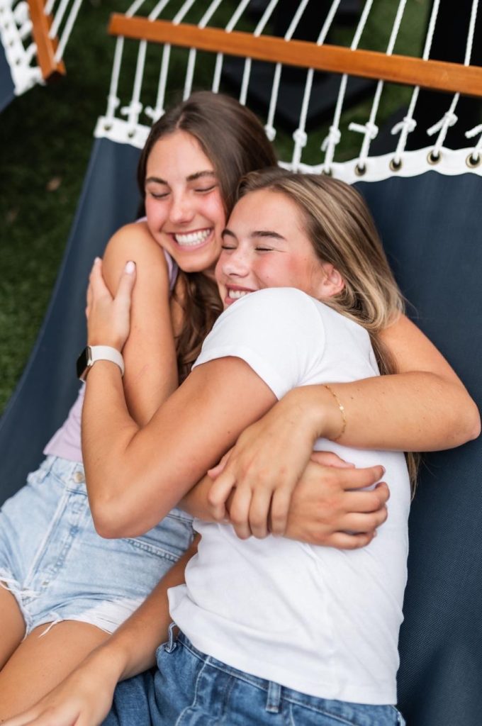 Two roommates outside of Rambler College Park South, an off-campus student apartment.