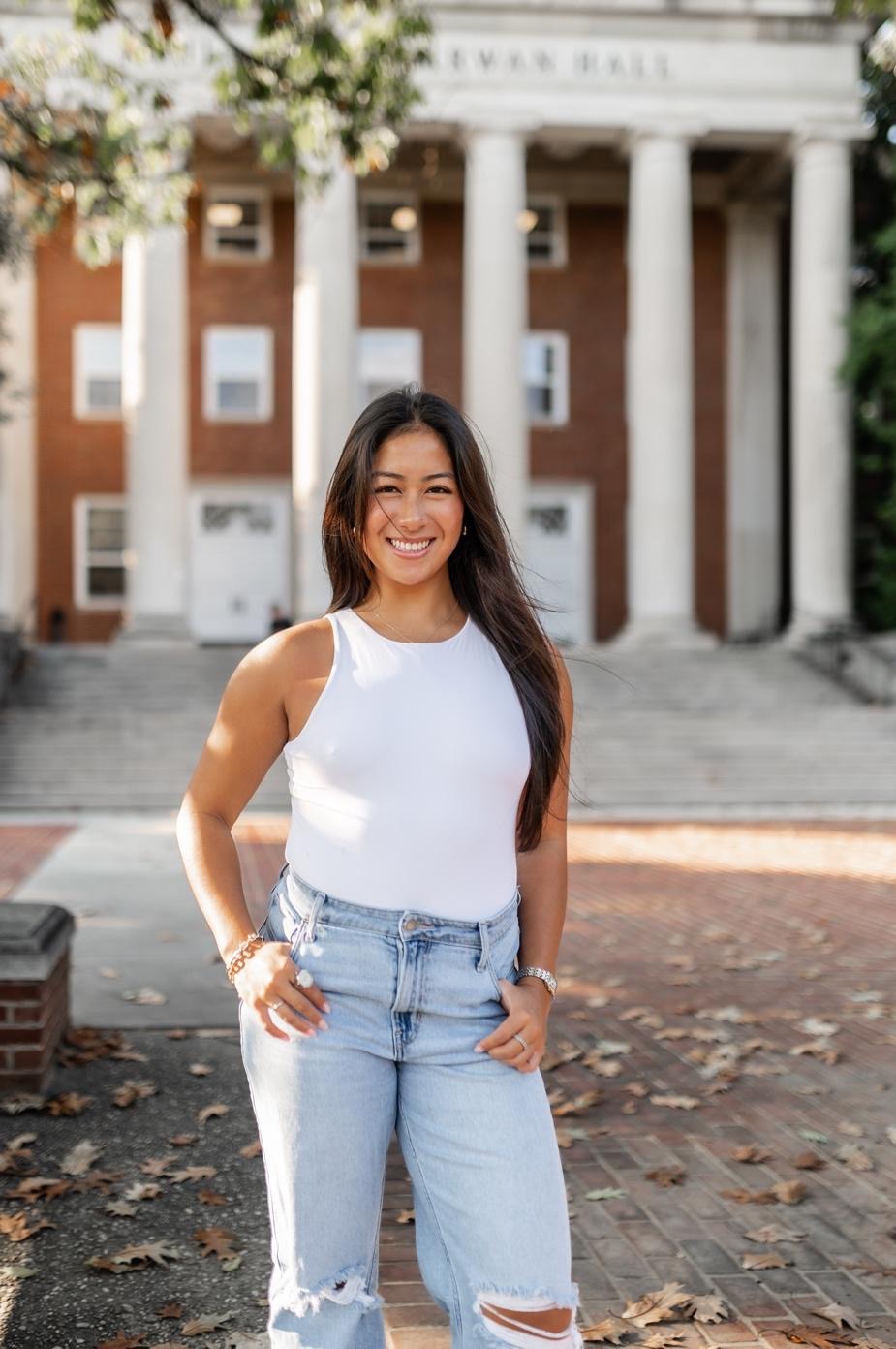 Student outside of William E. Kirwan Hall at UMD.