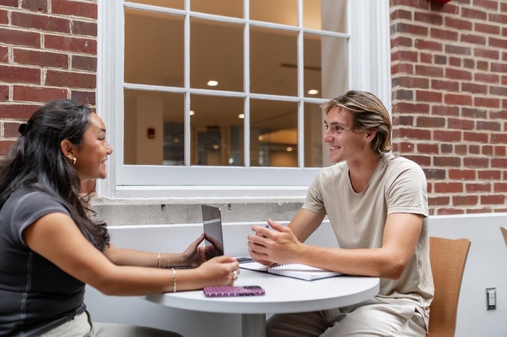Students talking outside of Adele H. Student Union at UMD. 