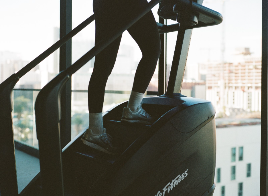 A UMD student uses a Stairmaster in the Rambler College Park gym. 