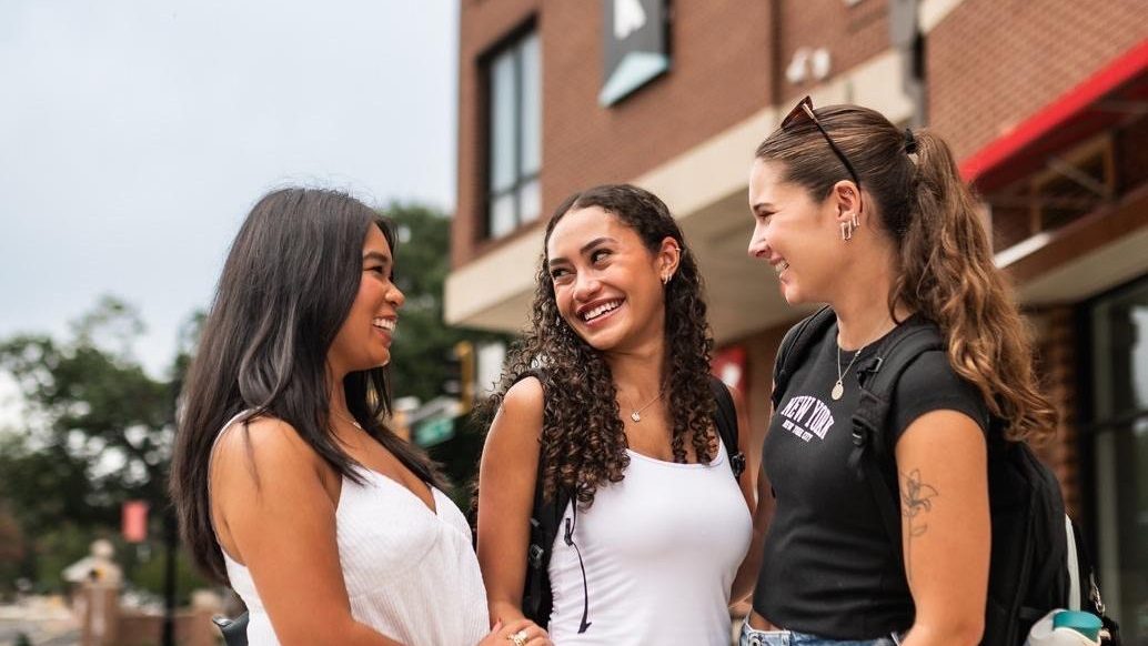 Students outside of Landmark Apartments at UMD.