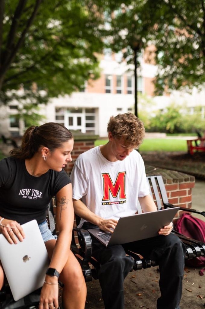 Students studying outside of Robert H. Smith School of Business.