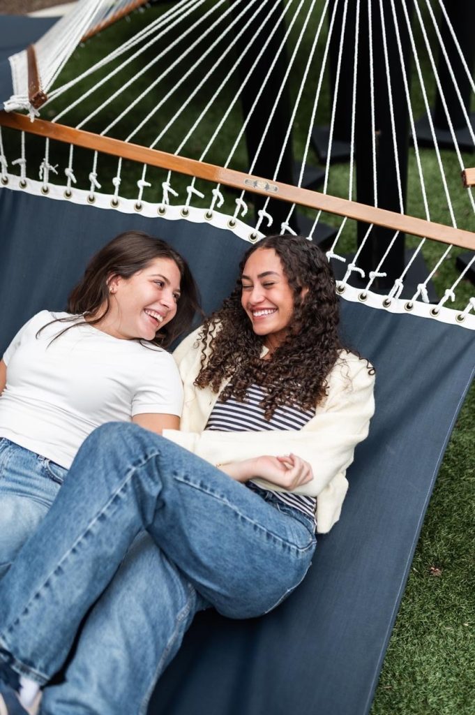 Two students spending time together at their off-campus apartment. 