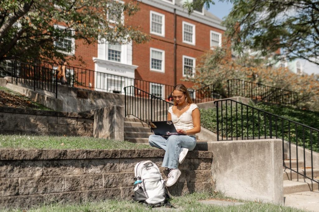 Student studying outside on McKeldin Mall on UMD’s campus.