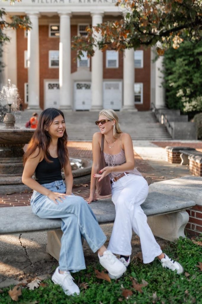 Students relaxing outside of William E. Kirwan Hall on UMD’s campus.